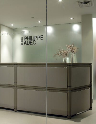 Modern retail store interior with clear glass entrance and frosted glass for privacy.